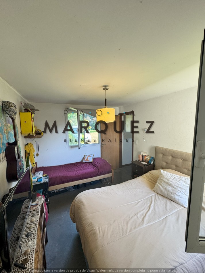 CASA CON AMPLIO TERRENO + PERIMETRO CERRADO CON PINOS